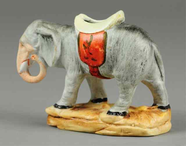 Appraisal: ELEPHANT WITH SADDLE STILL BANK Germany c porcelain example hand