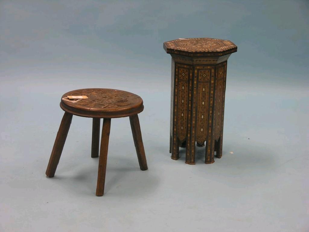 Appraisal: A Victorian oak stool circular top boldly carved with flowers