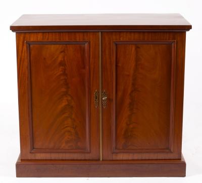 Appraisal: A mahogany cupboard enclosed by a pair of doors cm