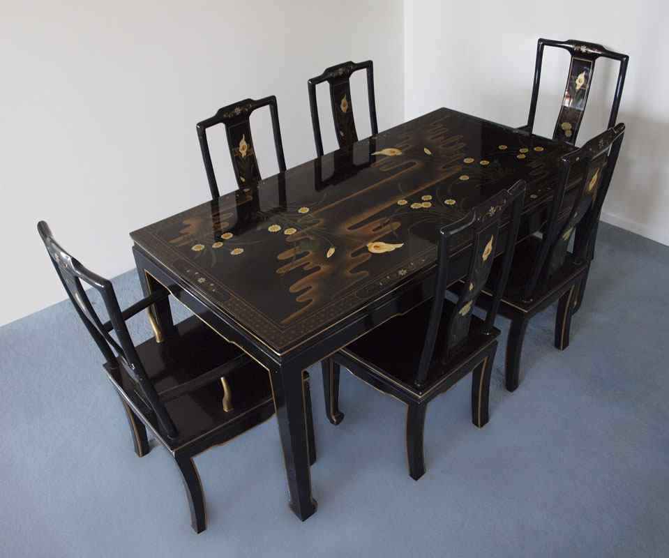 Appraisal: BLACK LACQUER CHINESE DINING TABLE WITH CHAIRS Chinese pond scene