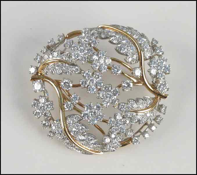 Appraisal: DIAMOND PLATINUM AND KARAT YELLOW GOLD BROOCH round brilliant diamonds