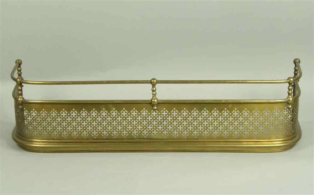 Appraisal: BRASS FIRE FENDER with rounded brass pole joined by balusters