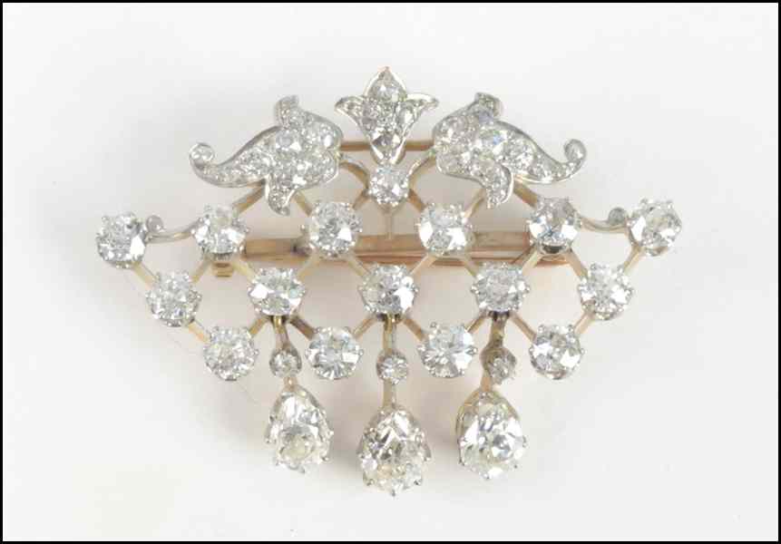 Appraisal: DIAMOND KARAT GOLD AND PLATINUM BROOCH Round and pear shaped