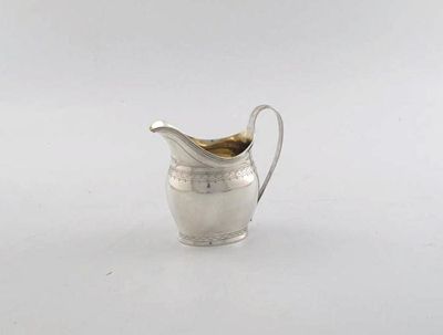 Appraisal: A George III helmet milk jug gilt lined with wigglework