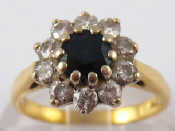 Appraisal: A yellow metal tests carat gold sapphire and diamond cluster