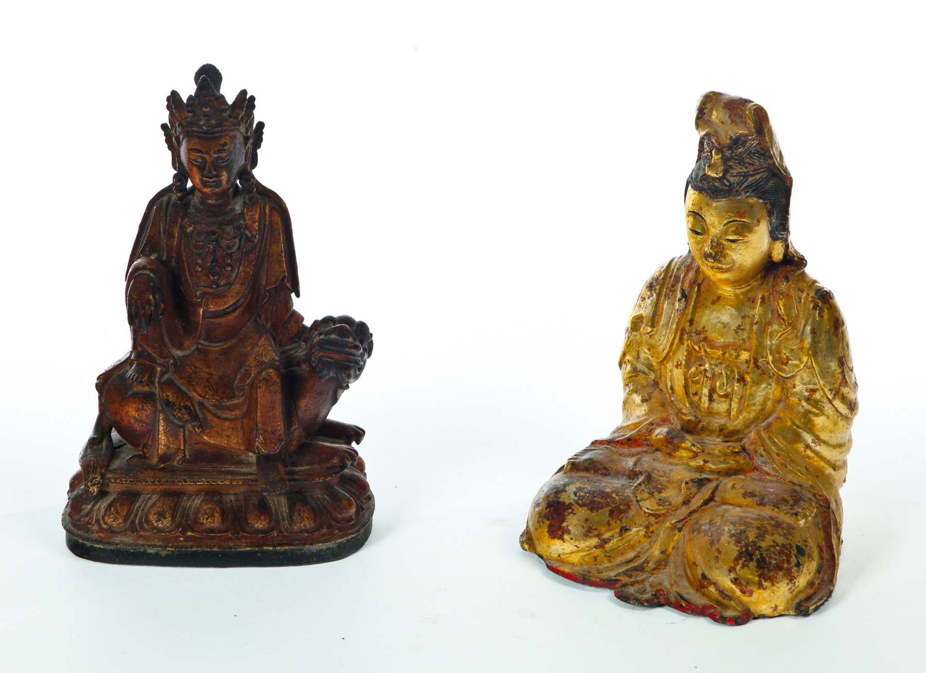 Appraisal: TWO BRONZE BUDDHAS China th century Seated one with an