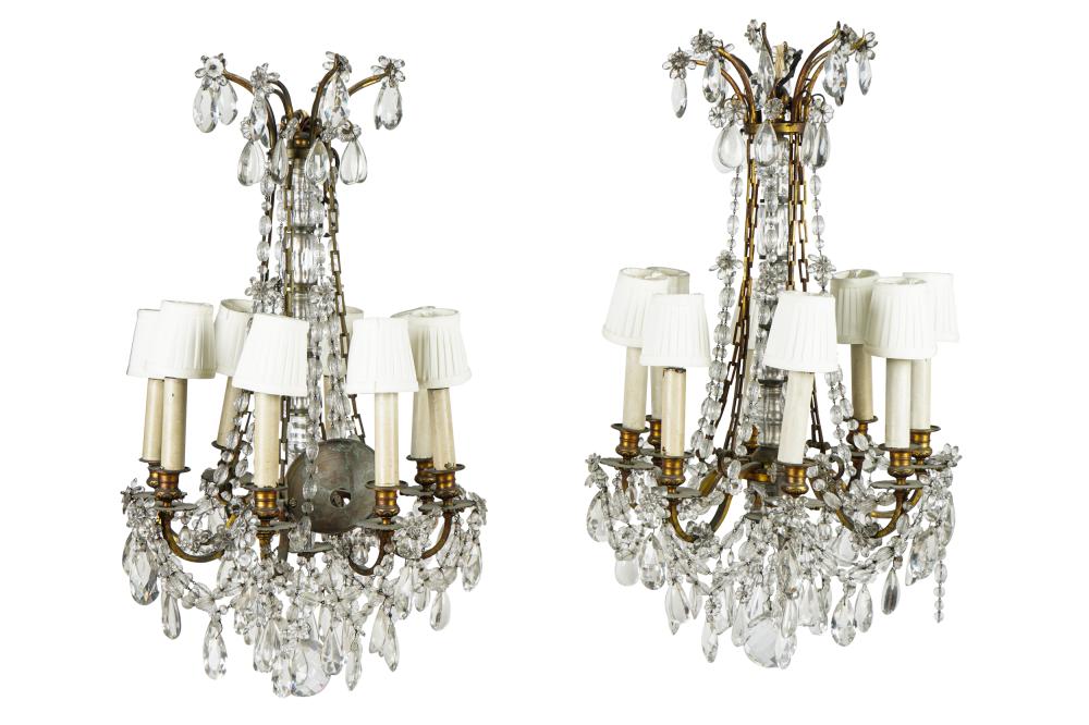 Appraisal: PAIR OF EIGHT-LIGHT CRYSTAL CHANDELIERSCondition with some prisms missing inches