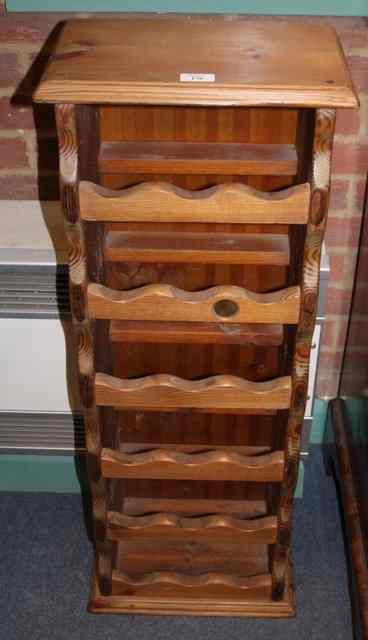 Appraisal: A PINE WINE RACK with six tiers wide