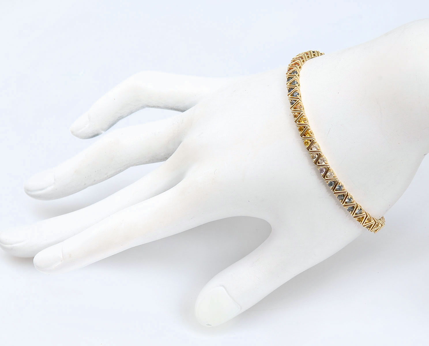 Appraisal: K SAPPHIRE BRACELET K yellow gold bracelet contains round faceted