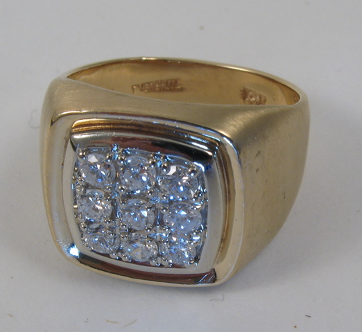 Appraisal: MAN'S DIAMOND AND FOURTEEN KARAT GOLD RING set with nine