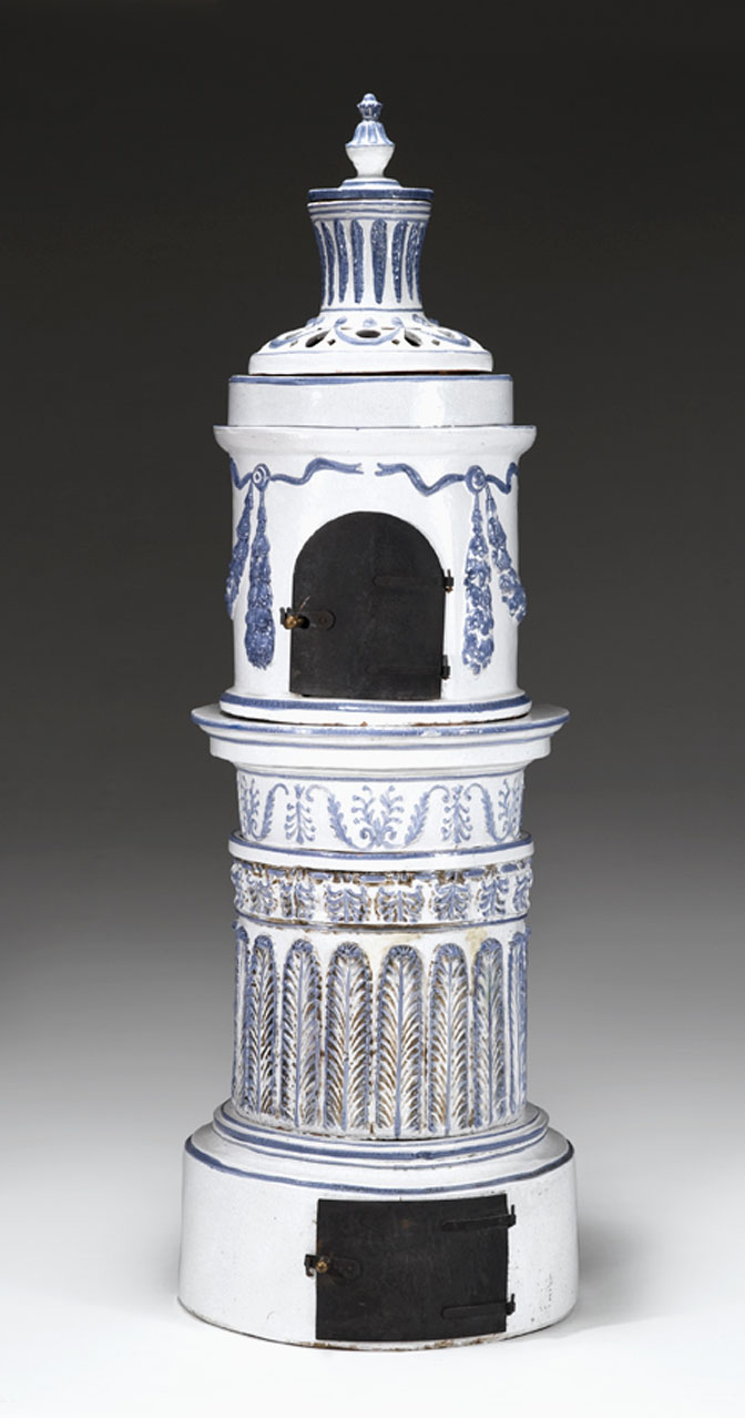 Appraisal: Continental faience stove Of columnar form with a pierced stack