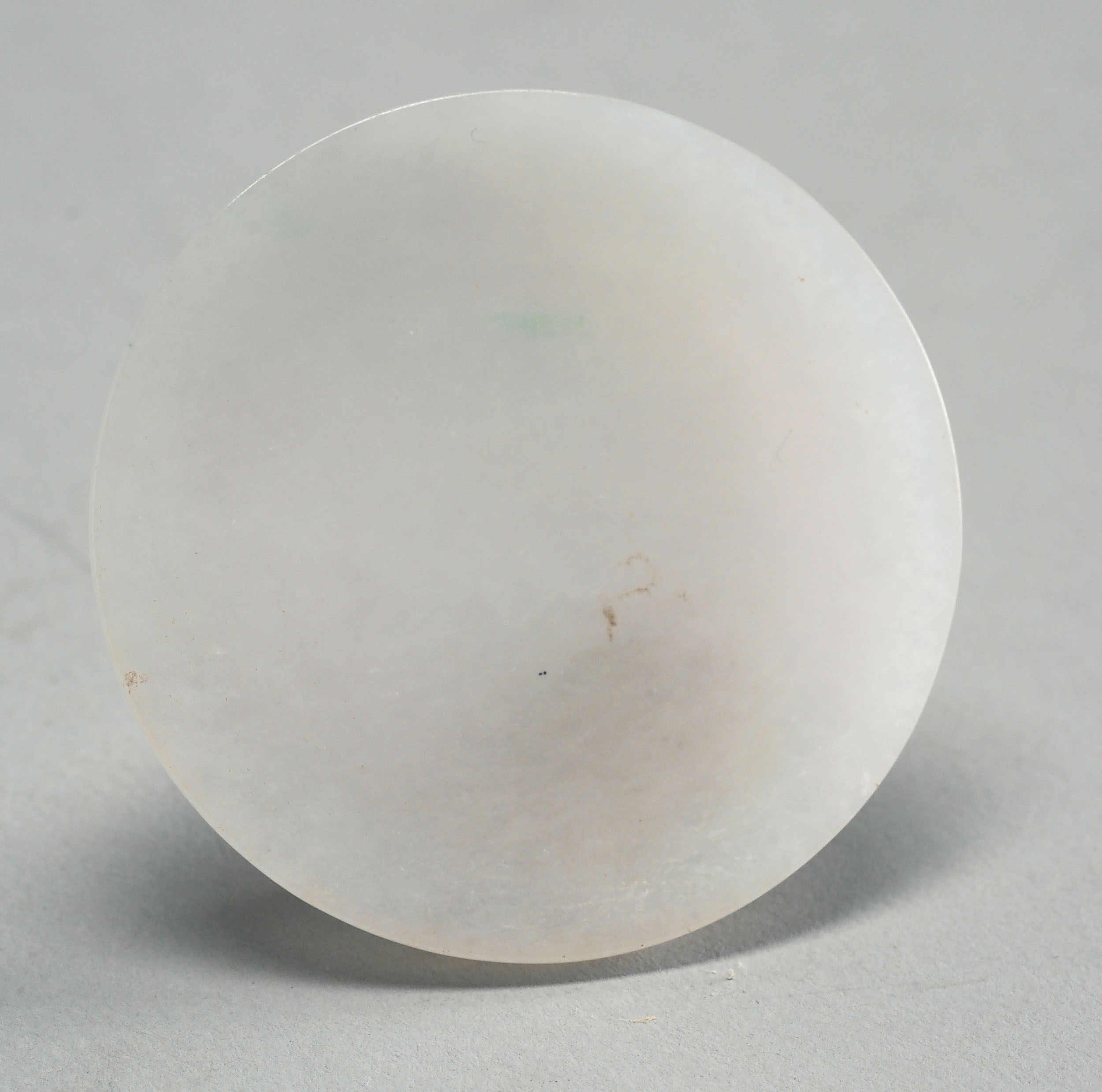 Appraisal: WHITE JADE SNUFF SAUCER th CenturyWith raised footring Diameter cm