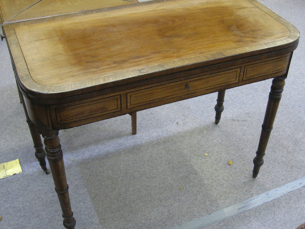 Appraisal: Rosewood crossbanded mahogany tea table upon turned tapering legs