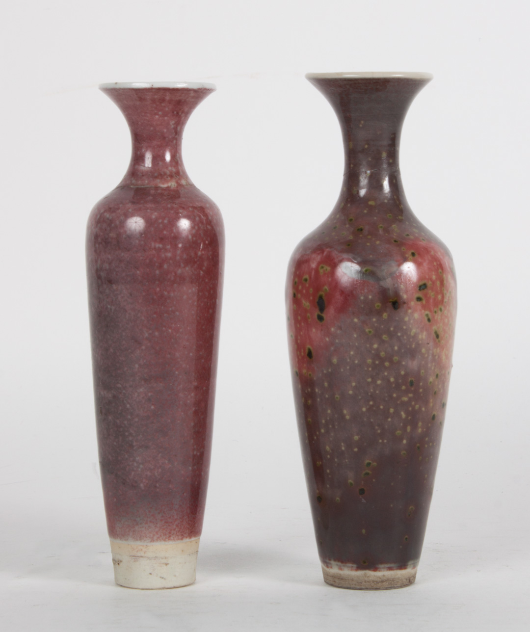 Appraisal: Two Chinese monochrome porcelain vases both with bleeding flambe glazes