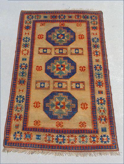 Appraisal: TURKISH KAZAK CARPET Approx ' '' x ' Brown field