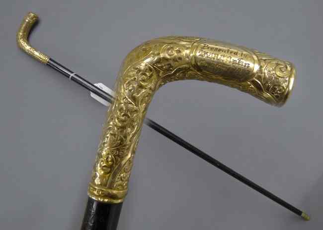 Appraisal: Gold tipped presentation cane ''by the employees of the Continental