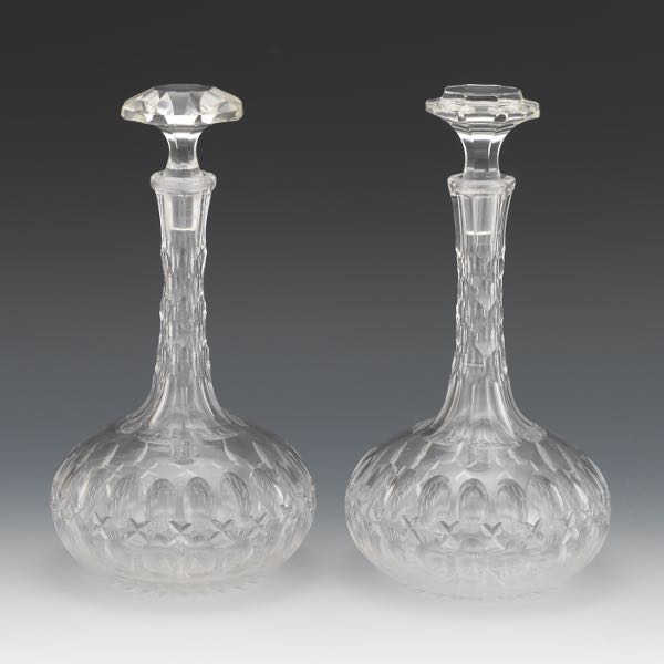 Appraisal: PAIR OF CUT GLASS DECANTERS WITH STOPPERS Bulbous hand blown