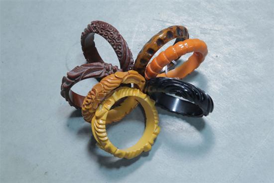 Appraisal: SEVEN BAKELITE BRACELETS All carved bangles some deep relief floral