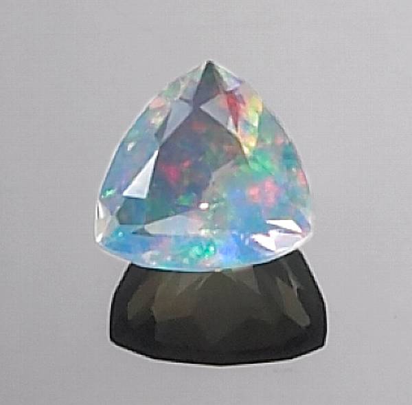 Appraisal: Jelly Opal Idar-Oberstein Germany A beautiful triangular-cut stone of fine-quality