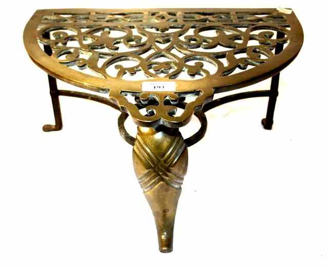 Appraisal: A TH CENTURY BRASS AND WROUGHT IRON TRIVET the semi