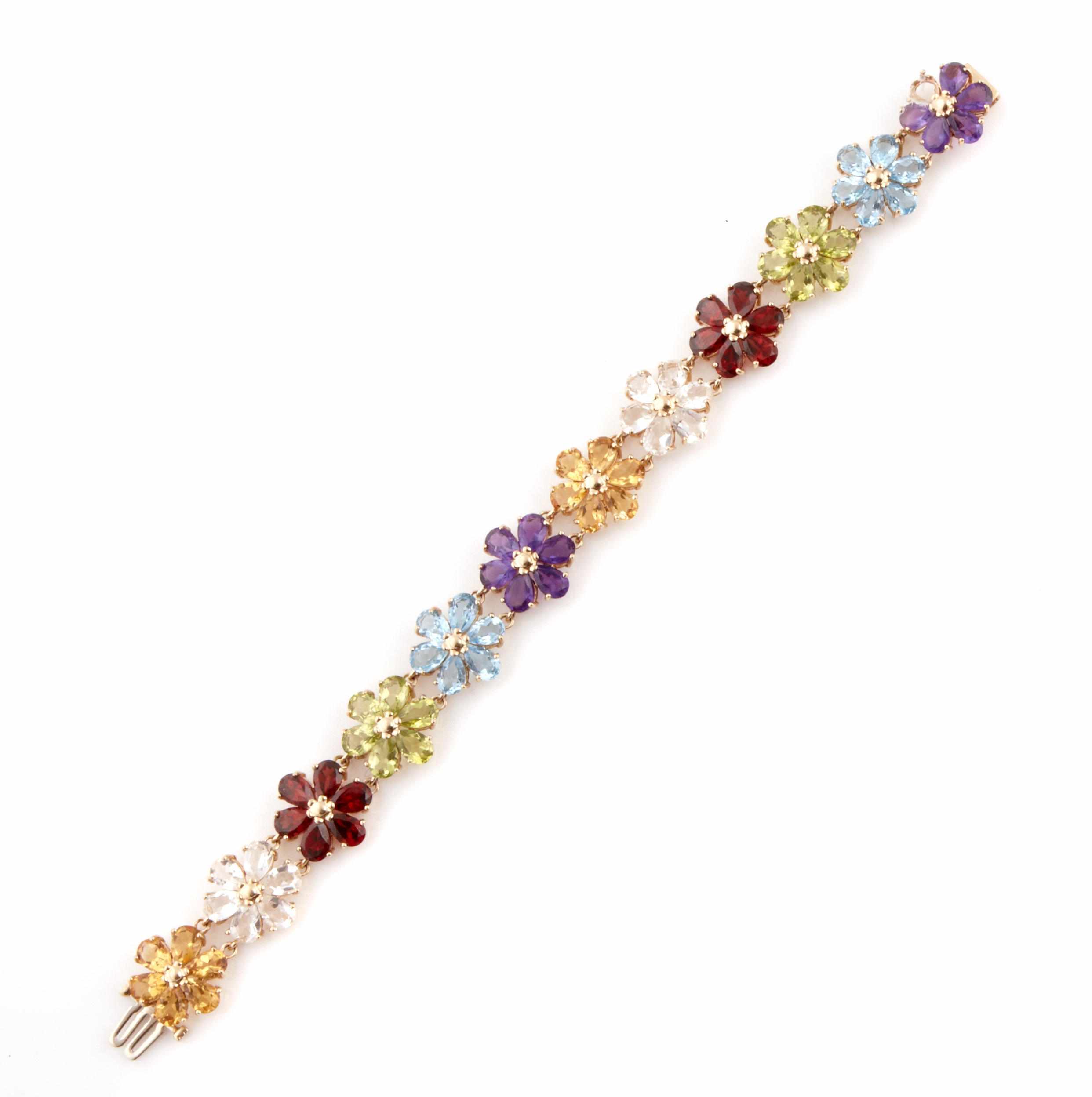 Appraisal: A gem-set and k gold floral bracelet length in