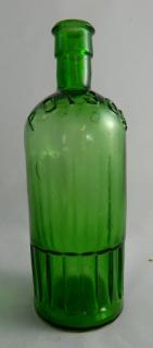 Appraisal: Poison green round bottle Poison- green round both shoulders are