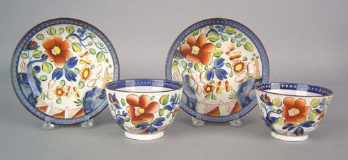 Appraisal: Two Gaudy Dutch cups and saucers th c in the