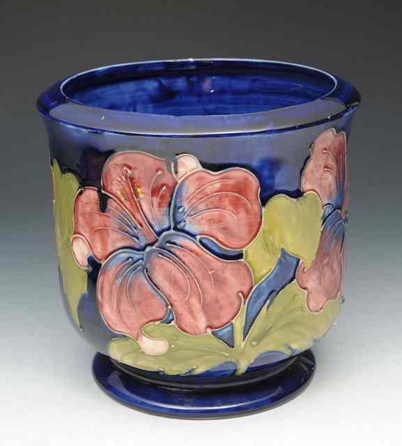 Appraisal: A MOORCROFT BLUE GROUND JARDINERE decorated with flowers high