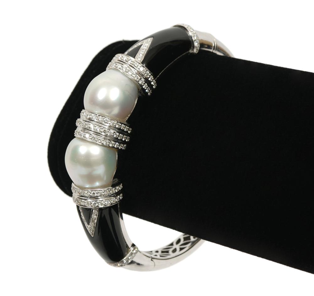 Appraisal: Contemporary diamond onyx white pearl hinged bangle bracelet in K