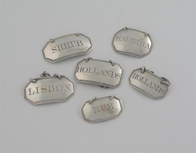 Appraisal: Six various George III canted oblong wine labels with reeded