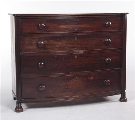 Appraisal: A Regency mahogany bow front chest the reeded top with