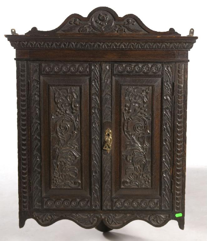 Appraisal: th CENTURY CARVED OAK HANGING CORNER CUPBOARD in th century