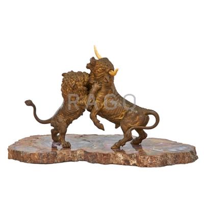 Appraisal: EUROPEAN COLD-PAINTED BRONZE Lion and ivory horned bull fighting pose