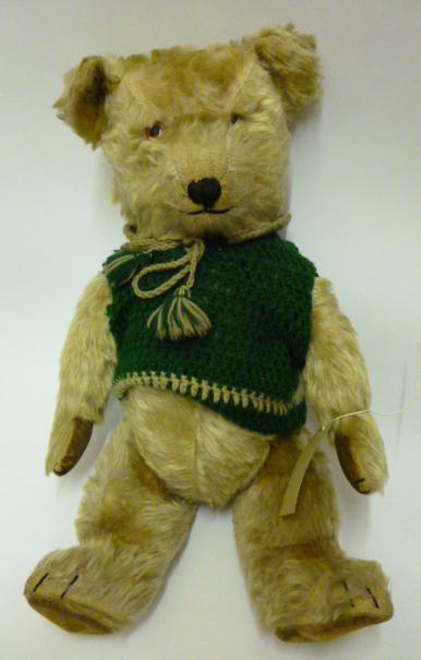 Appraisal: A Chiltern bellows operated musical teddy bear covered in gold