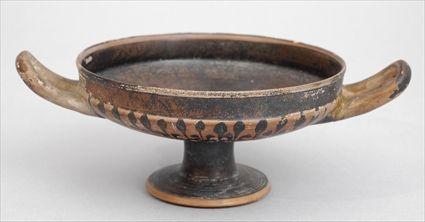 Appraisal: GREEK REDWARE POTTERY KYLIX The shallow -handled bowl painted on