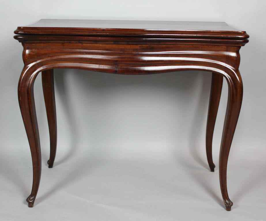 Appraisal: CONTINENTAL MAHOGANY GAMES TABLE mid- th century the serpentine hinged