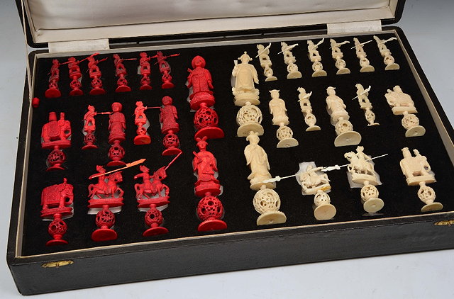 Appraisal: A CHINESE WALRUS IVORY CHESS SET the carved figures each