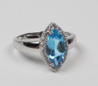 Appraisal: K DIAMOND AND BLUE TOPAZ LADY'S RING K WHITE GOLD