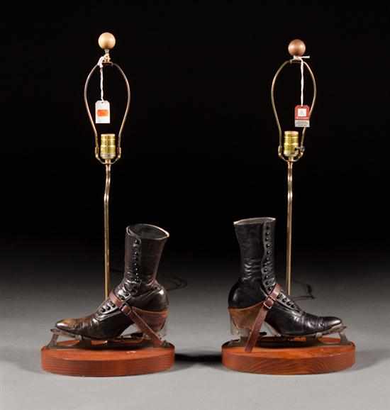 Appraisal: Pair of Victorian leather women's shoes with ice-skating attachments mounted