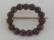 Appraisal: A Bohemian garnet circlet brooch within a gilt metal mount