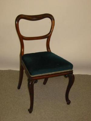 Appraisal: A SET OF FOUR VICTORIAN ROSEWOOD DINING CHAIRS of plain