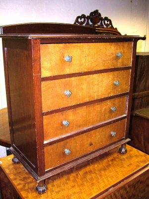 Appraisal: A mahogany chest th century of four drawers upon octagonal