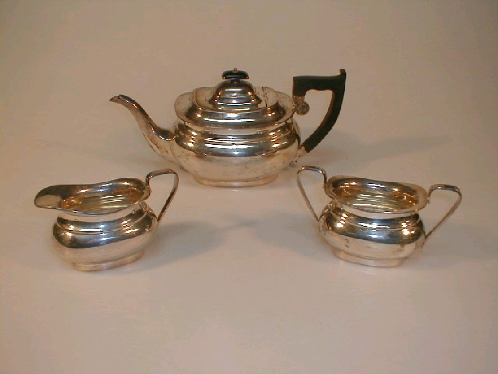 Appraisal: A Viners silver three piece tea service of classical boat