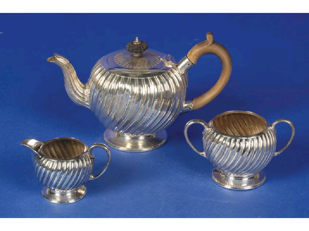 Appraisal: A VICTORIAN THREE PIECE TEA SET of bullet-form with fluted