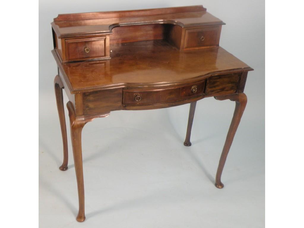 Appraisal: An Edwardian mahogany writing table the raised back with two