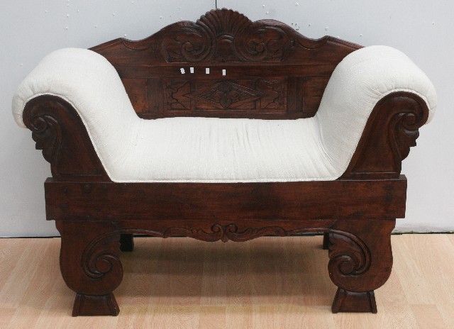 Appraisal: A stained pine love seat with white upholstery