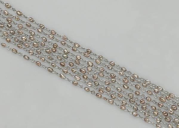 Appraisal: A colored diamond and eighteen karat white gold long chain