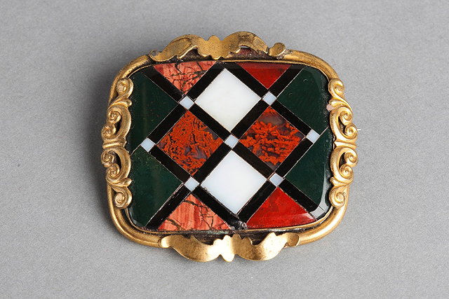 Appraisal: A SCOTTISH AGATE BROOCH of chequered form and mounted in