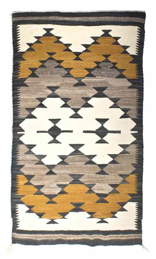 Appraisal: A Navajo Wool Weaving in the manner of the Two