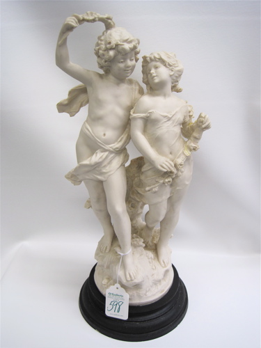 Appraisal: COMPOSITE FIGURAL SCULPTURE of a young boy and girl mounted